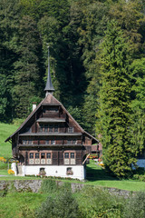 Fototapeta na wymiar Rural view of a farm with beautiful house at Wolfenschiessen