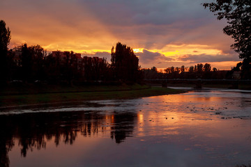Fototapeta premium River sunset reflection of sun