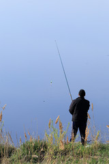 fisherman on the river bank
