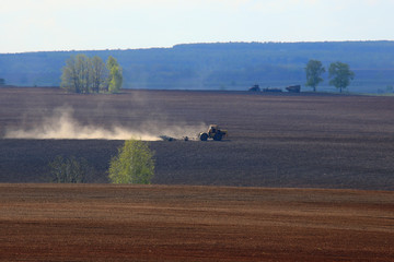 Naklejka na ściany i meble tractor in a field