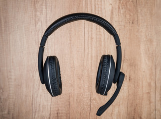 Headset on wooden background