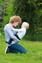 Fototapeta premium Mother and daughter in spring sunny park