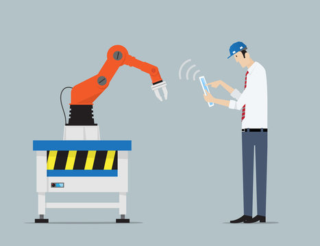 Industry 4.0 Factory Automation Concept. Robot hands controlled by engineer with Tablet PC. .