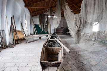 handmade old fishing net inside fisherman house