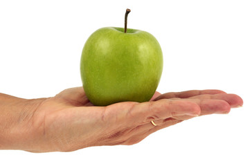 Pomme verte pr&eacute;sent&eacute;e sur la plat de la main
