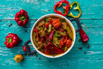 Delicious Hungarian goulash with beef and red pepper stewed with vegetables and herbs.