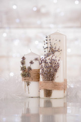 Christmas candles with dry lavender on glass table