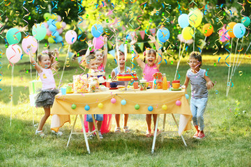 Children celebrating birthday in park