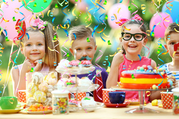 Children celebrating birthday in park