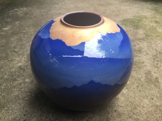 Blue antique jar on cement background