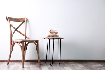 Simple interior with stool and decorations on white wall background