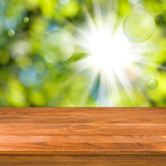 Fototapeta na wymiar wooden table on green background