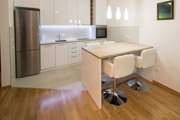 Fototapeta na wymiar Modern interior of open-plan kitchen and living room