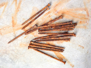 Nails old rust brown. Placed on a cement background
