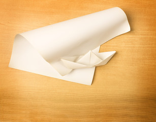 thinking differently concept, great ideas come from simple steps concept, paper boat and paper on wood background