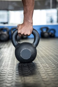 Cropped Hand Holding Kettlebell 