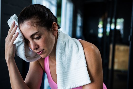 Female Athlete Wiping Sweat 