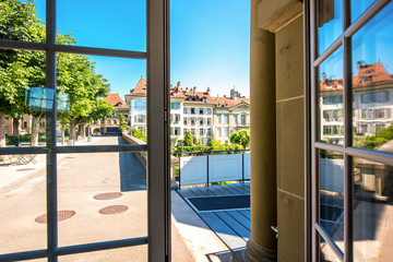 View from the window on the park and buildings near Munster church in the old town of Bern in Switzerland