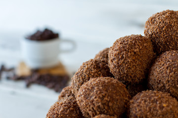Pile of brown sweets. Dark candies with crumbs. Freshly made chocolate balls. Mixture of cookies and butter.