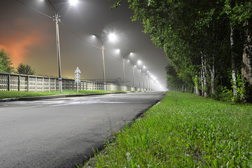 Naklejka premium Дорога под фонарями