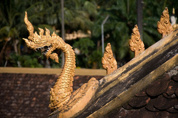 Laos travel landmark, golden pagoda wat Phra That Luang in Vientiane. Buddhist temple. Famous tourist destination in Asia.