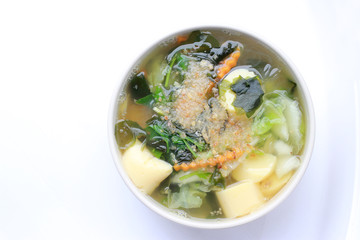 Thai style Seaweed soup with Bean Curd , mixed vegetable, Tofu  in white bowl on white background. Vegetarian Food, Healthy food, Thai food