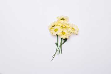 Bouquet of yellow flowers on a white table
