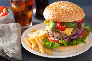 homemade cheese burger with peppers tomato onion