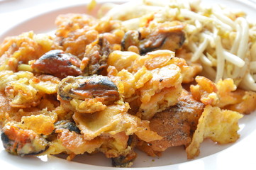 crispy fried mussel with egg and bean sprout on dish
