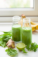 healthy green spinach smoothie with cilantro lime banana ginger