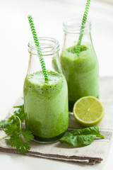 healthy green spinach smoothie with cilantro lime banana ginger