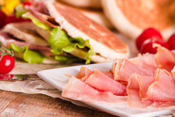 Tigella bread stuffed with ham and lettuce.