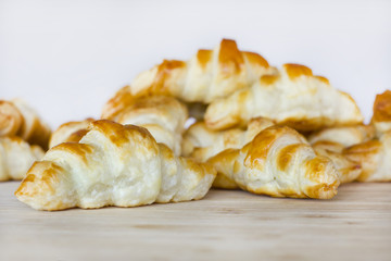 Croissants on a wooden surface.