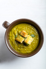 Green squash soup with parsley and croutons