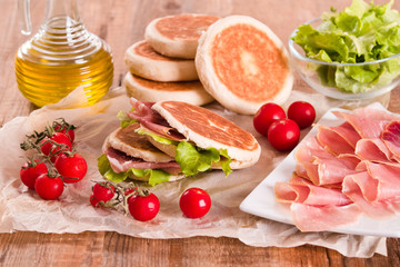 Tigella bread stuffed with ham and lettuce.