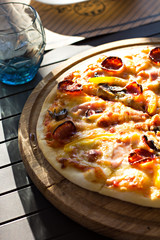 pizza with salami and tomato