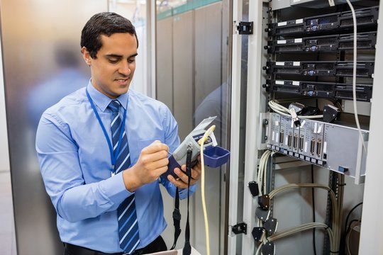 Technician using digital cable analyzer