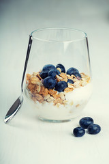 Dietetic breakfast - yoghurt with muesli and huckleberries