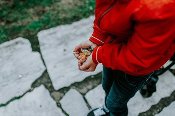 Boy with a handful of sweets