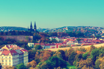 View to the Vysegrad in Prague, Czech Republic at autumn with cathedral and red roofs, travel seasonal vintage hipster background