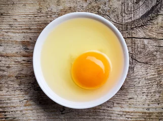 Ingelijste posters Bowl of egg yolk from above © bigacis