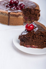 Fototapeta na wymiar Chocolate cake with juicy cherries