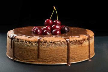 Chocolate cake with juicy cherries