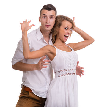 Surprised Young Couple On White Background, Isolated