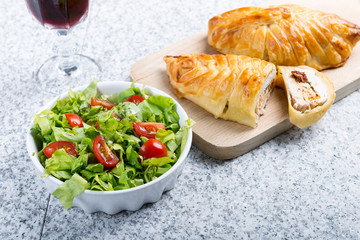 Chicken breast in french pastry with fresh salad