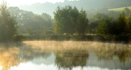 Misty morning over the lake in Axe Valley, Devon