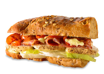 Sandwich with chicken fillet, bacon, lettuce and tomato on wholemeal French bread. Isolated.