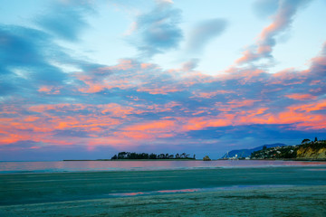 Colorful sunset sky with overcast clouds  at Wharariki Beach, Nelson
