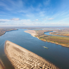 Tug ship with barge on the great river