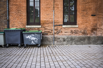 trash containers in a street in Toulouse France